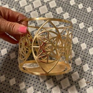 Never used candle holder. Rose pink/goldish color